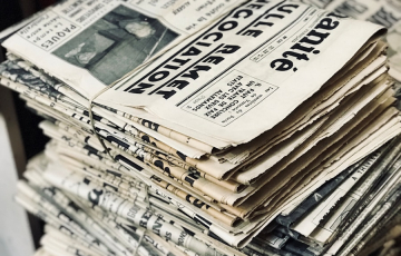 bundle of newspaper on table