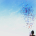 woman throwing confetti into blue sky